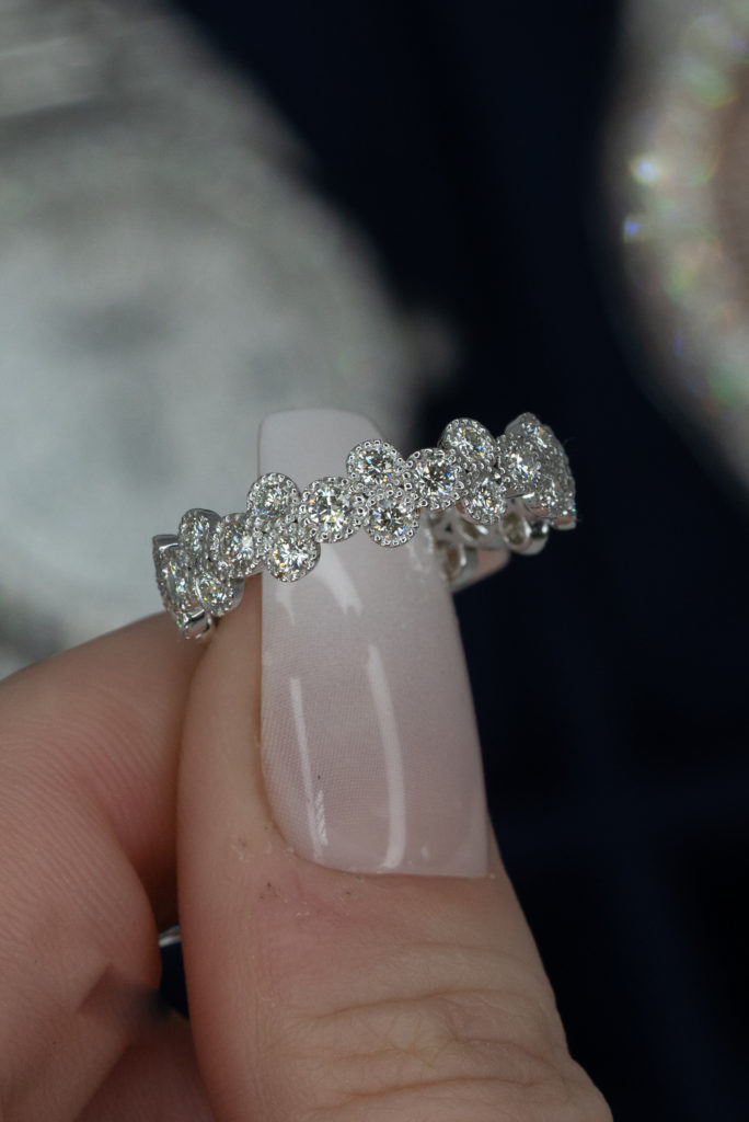 a round diamond halo eternity band