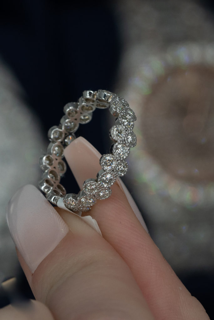 a round cut halo eternity band